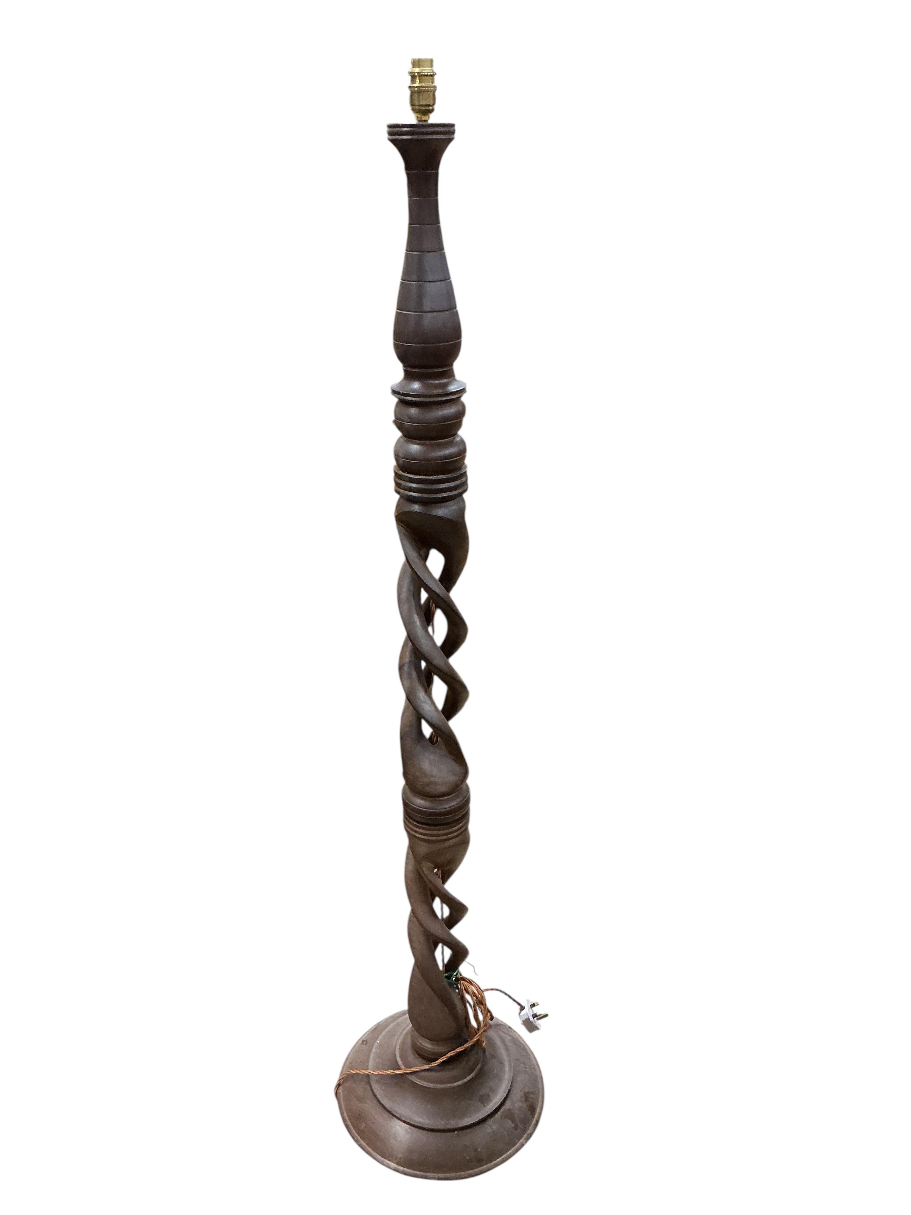 A carved hardwood open twist standard lamp, (re-wired), height 156cm